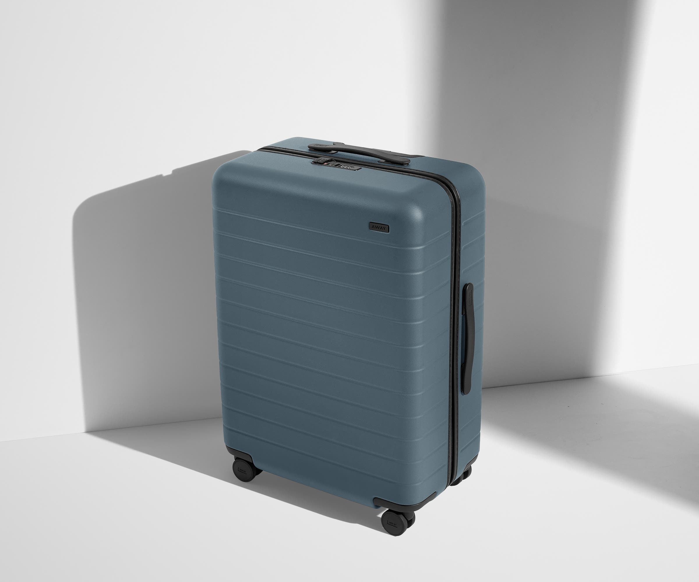 Angled product view of The Medium suitcase in Coast Blue