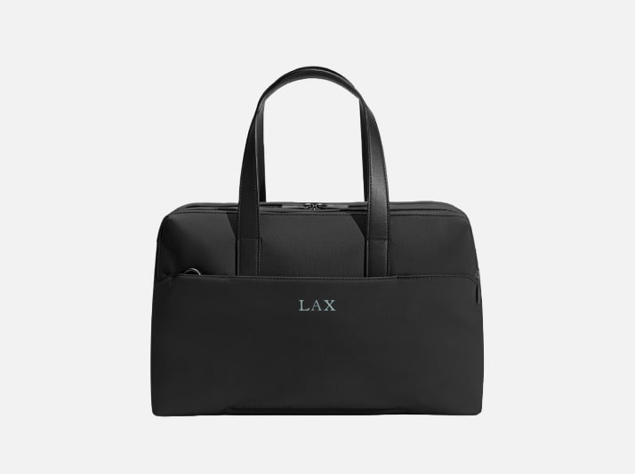 An Away duffle with initials embroidered on the back