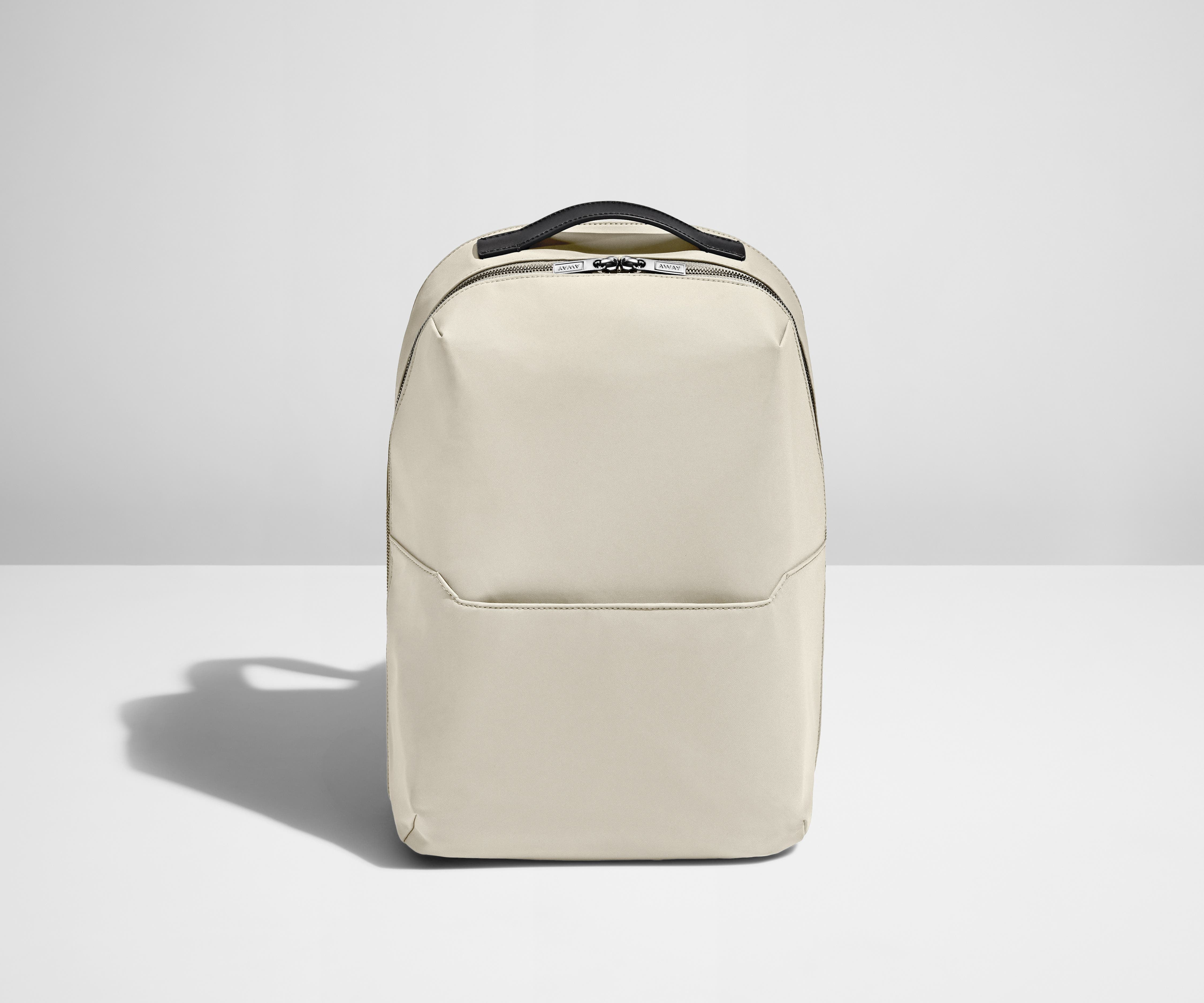 Front view of the Salt White Everywhere Zip Backpack