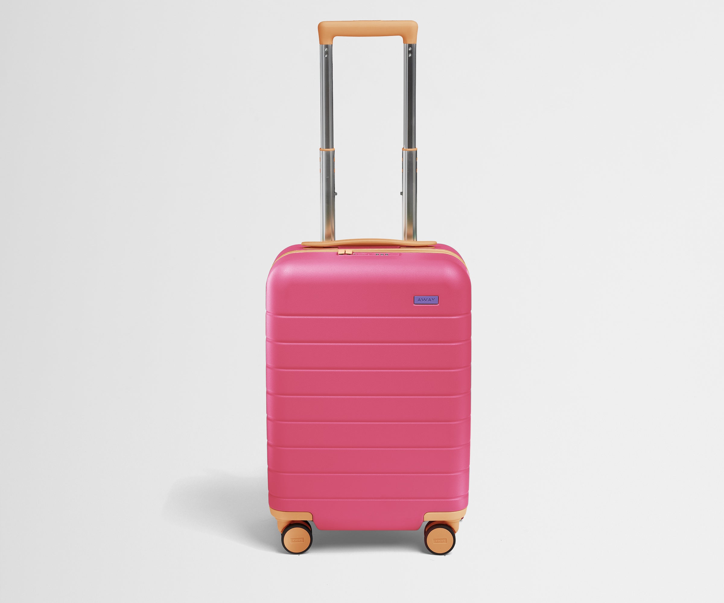 Front product view of The Kids Carry-On suitcase in Cotton Candy Pink with raised handle